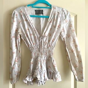 Reformation top with long sleeves, deep V, smocked waist  & ruffle hem Size S